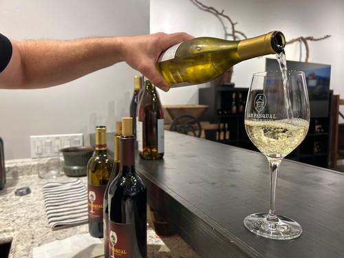 Pouring wine in the Vineyard Room
